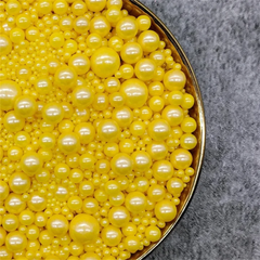 MIXED SIZES YELLOW SUGAR PEARLS 125 GMS