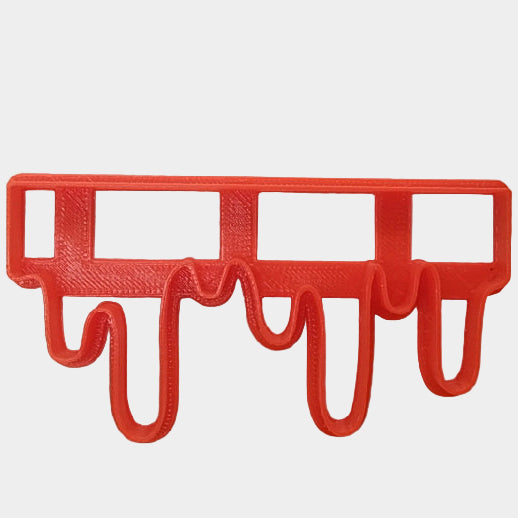 plastic chocolate drip border cutter designed for decorating fondant cakes.