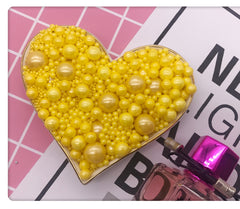 MIXED SIZES YELLOW SUGAR PEARLS 125 GMS